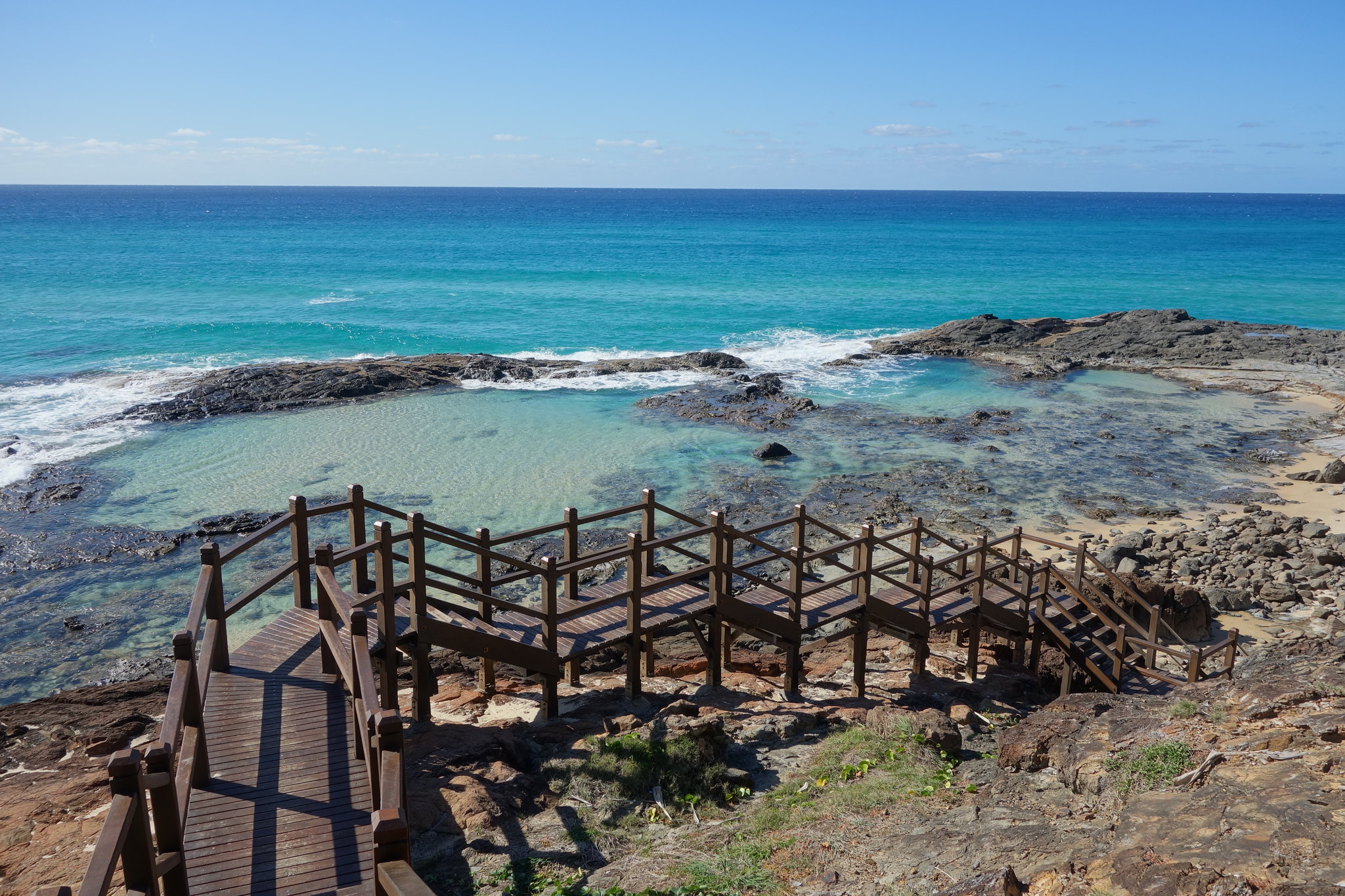 Take a dip in the Champagne Pools